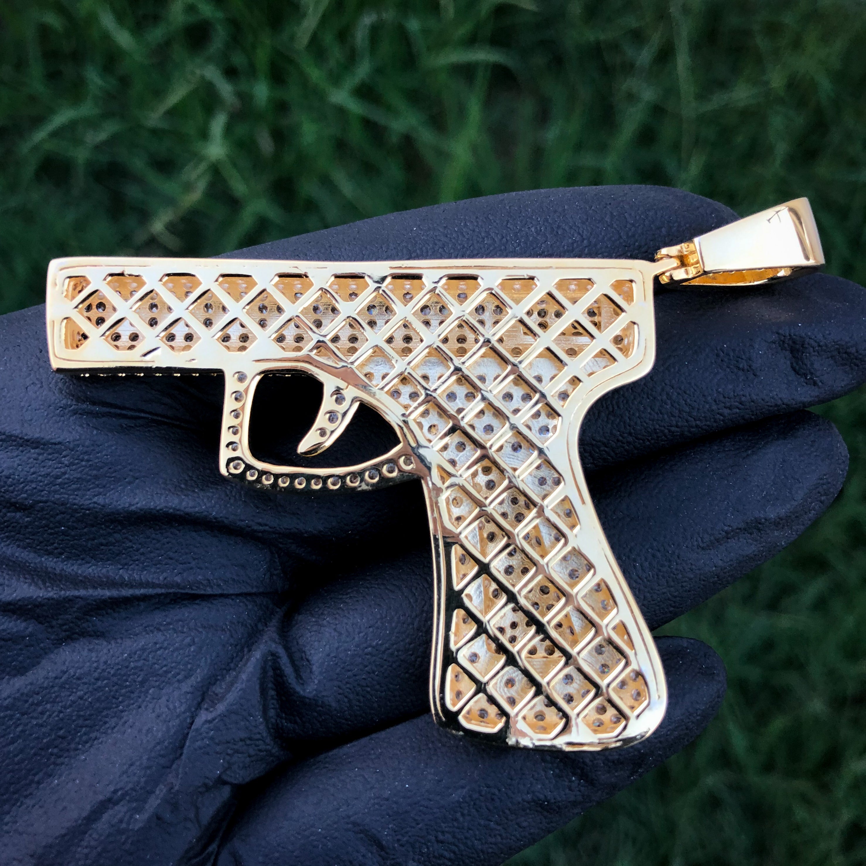 Iced out gun on sale pendant